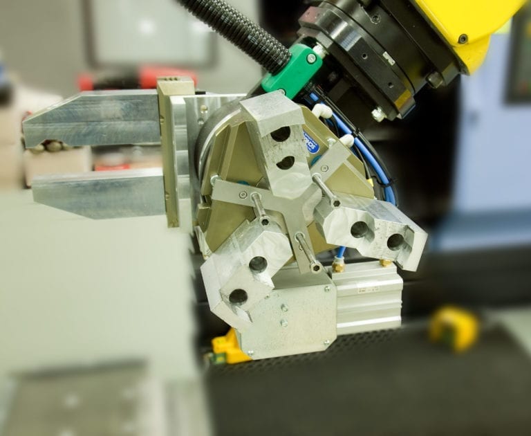 Workpiece exchange - robot gripper To automate the workpiece exchange, manufactured parts need to be gripped with a robot.